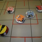 The Roomba Pac-Man moves about the floor picking up little white squares, and tries to avoid Inky, Pinky, Blinky and Clyde until he eats a power pellet, check out the video of it in action.