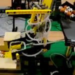 Huge Awesome Lego Machine, Uses Robot Arms Conveyors And Trucks (video)