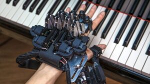 Exoskeletons Help Pianists Overcome the Ceiling Effect