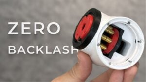 Close-up of a 3D-printed angular gearbox showcasing precision mechanics