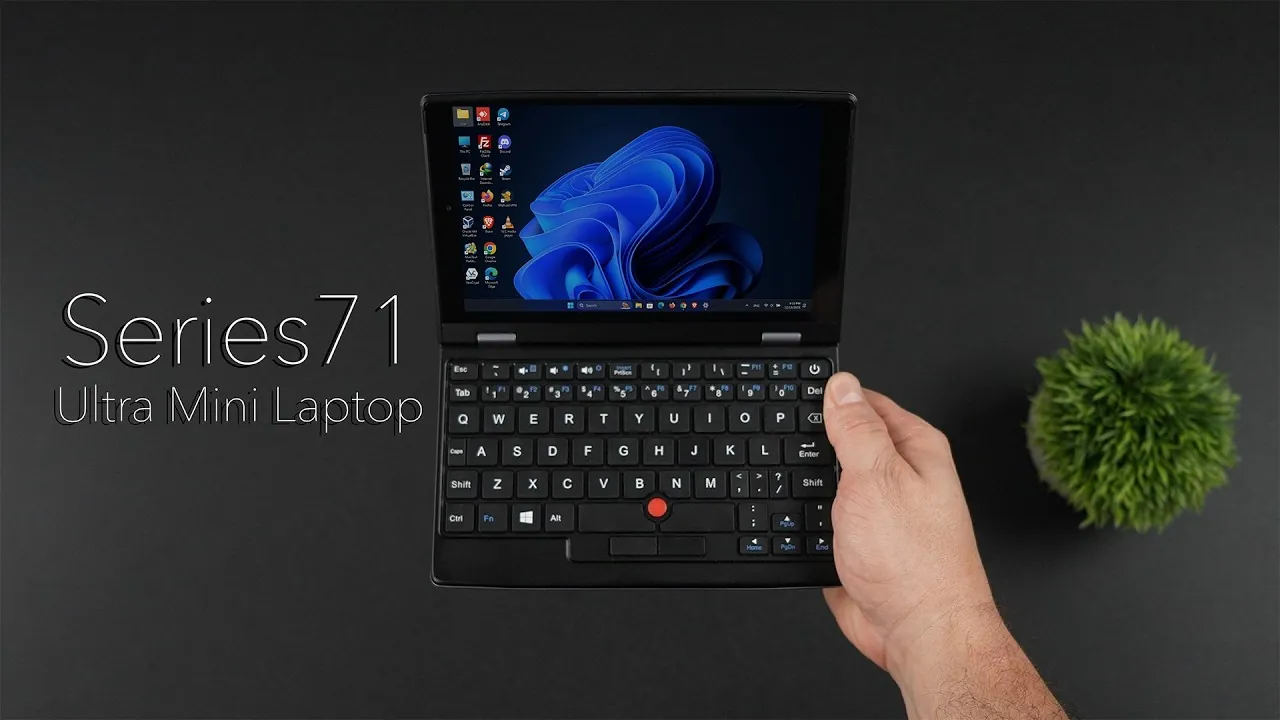 Portable mini laptop placed on a desk, highlighting its compact size