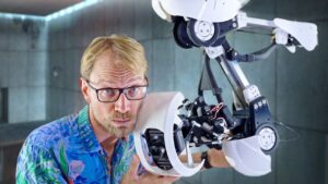 Caroline low-cost robotic arm in a studio setup delivering smooth, precise motion