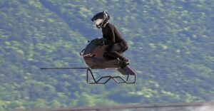 Volonaut Airbike hoverbike taking off for a personal commute above city traffic.