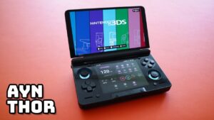The AYN Thor handheld console featuring dual OLED screens and a sleek clamshell design