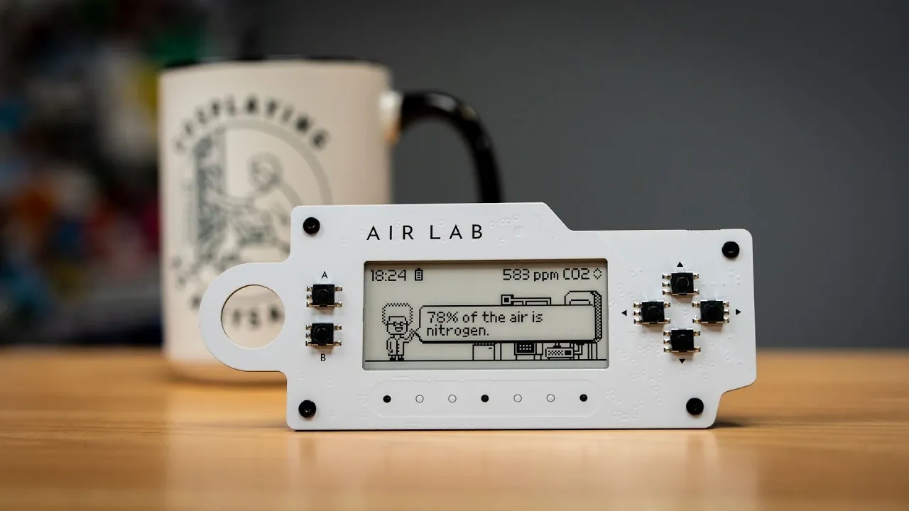 Air Lab portable air quality monitor with e-paper screen showing CO2 and VOCs