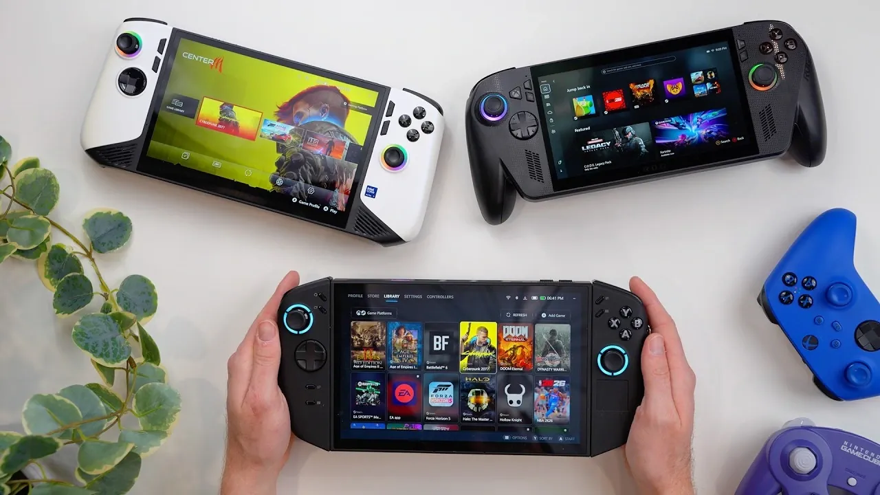 Lenovo Legion Go 2 on a desk showing its 8.8-inch OLED screen running at 144Hz with detachable controllers attached.