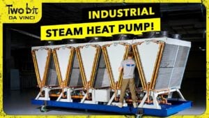 Control panel display highlights COP near 2 while the unit delivers steam, with added cooling offsetting tower load.