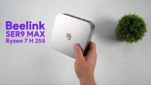 Compact Beelink unit with Ryzen 7 H255 and Radeon 780M shown beside controller, highlighting quiet, small-room gaming.