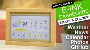 Close-up of a 7.3 inch Waveshare panel connected to a small Pi board, displaying a clean clock and forecast.