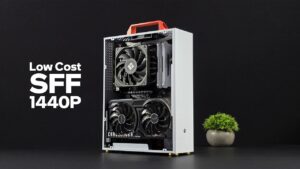Compact budget tower with Intel Arc A570 showing 1440p gameplay on screen, fans added for better airflow.