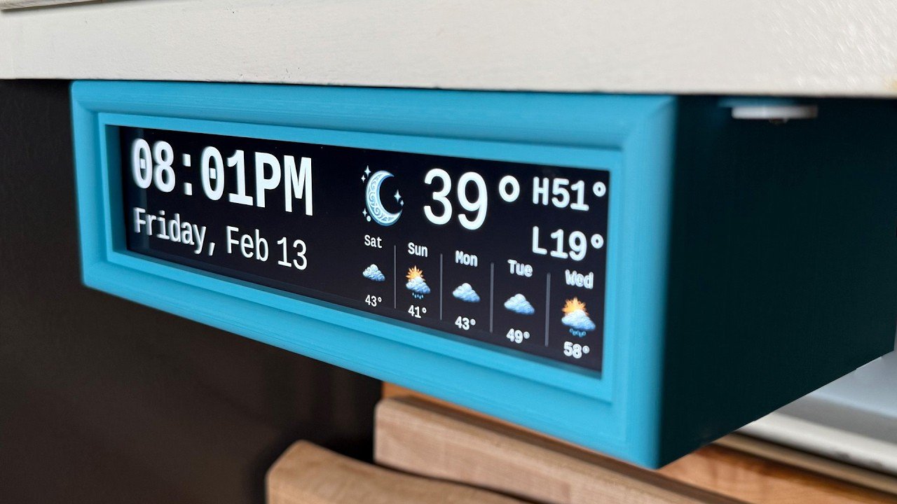 Raspberry Pi clock display mounted under a kitchen cabinet, showing large time and local weather at a glance.