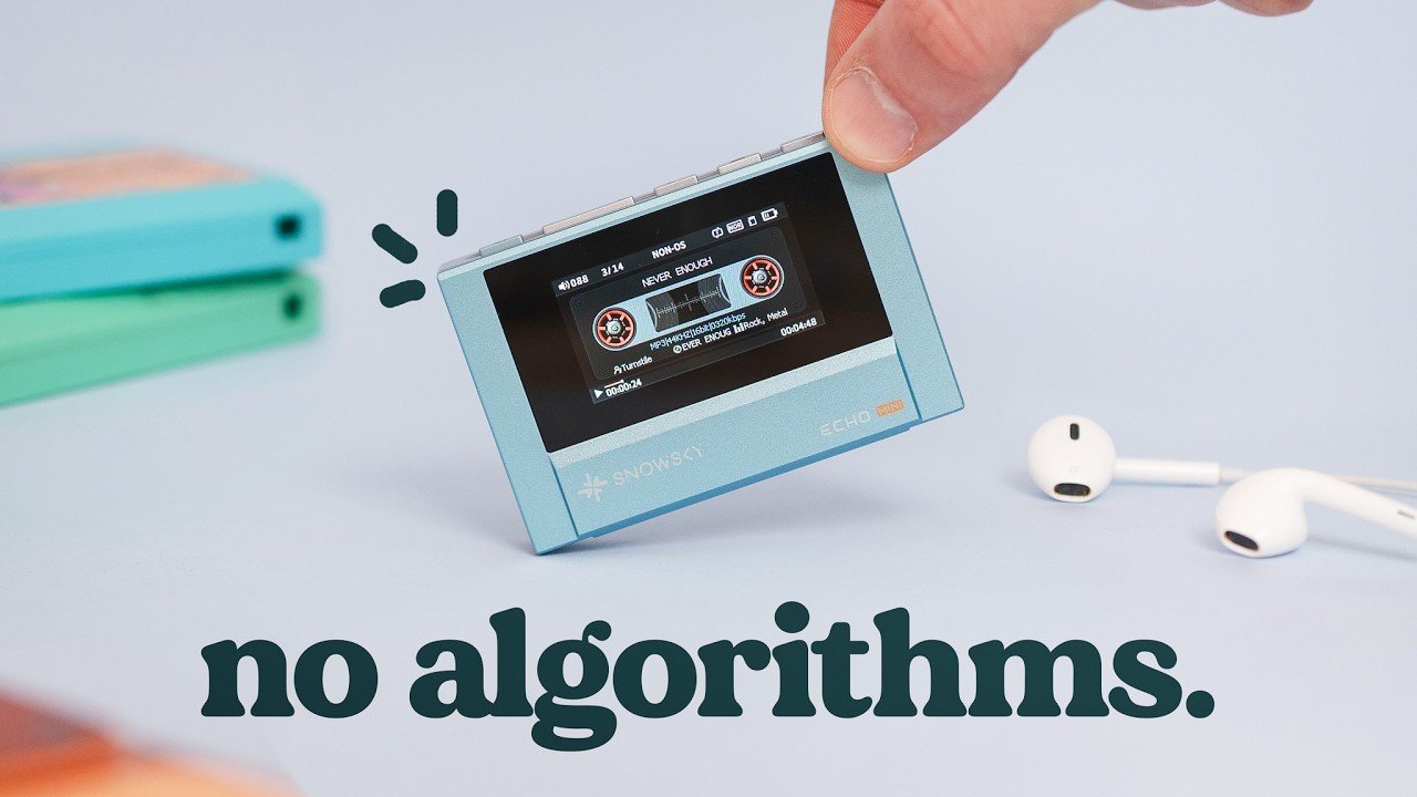 A Snowsky Echo Mini MP3 player with cassette styling sits beside wired earbuds and a microSD card.