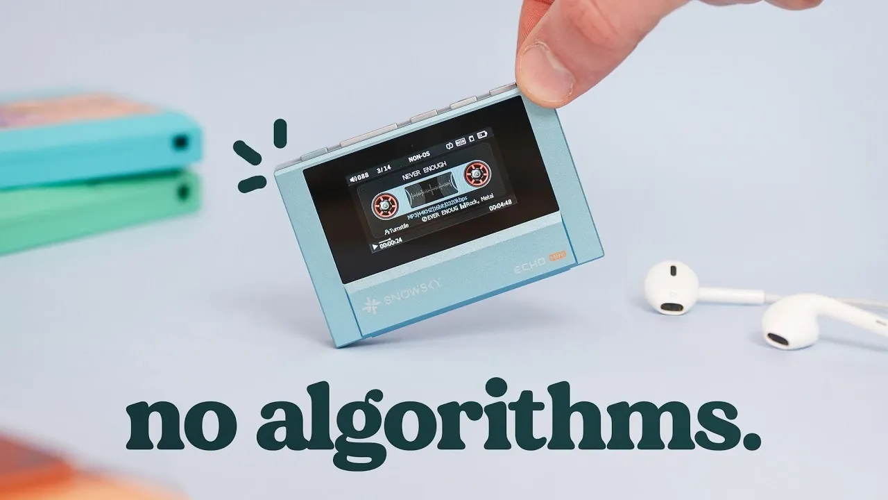 A Snowsky Echo Mini MP3 player with cassette styling sits beside wired earbuds and a microSD card.