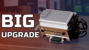 Two hard drives mounted in the optional ZimaBoard 2 cage with a PCIe card installed above them.