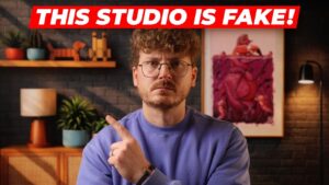 Creator sits in front of a TV showing an AI-made studio scene with matched key and fill lighting.