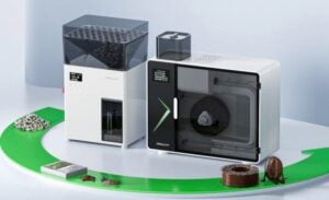 Close view of the M1 extrusion path showing multi-zone heating controls and a filament sensor.