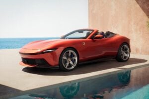 Soft-top roof of the Amalfi Spider mid-motion, showing the 13.5-second mechanism at low driving speed.