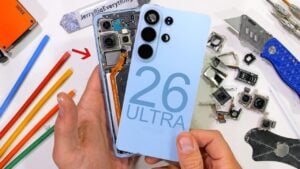 Open Samsung Galaxy S26 Ultra showing stacked motherboard, battery pull tabs, and internal connectors during teardown.