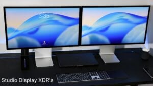 Studio Display XDR stand in use, showing height and tilt adjustments with the braided power cable routed behind.