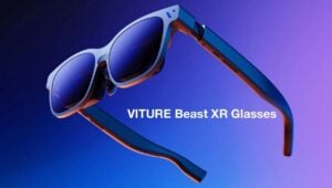 Gamer wearing VITURE Beast XR Glasses playing a handheld console.