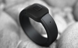 Person activating the voice recording button on the Pebble Index 01