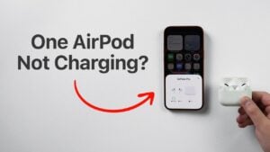 Finger pressing the AirPods case reset button until the light flashes amber after about 20 seconds.