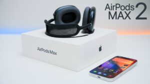 AirPods Max 2 pictured in multiple new colors, including Midnight and Orange, with the same overall shape.