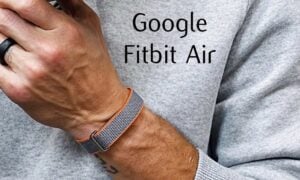 Person wearing the display-free Fitbit Air band on their wrist while exercising.