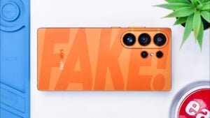 Side-by-side teardown view comparing fake S26 Ultra and fake S25 Ultra battery and motherboard layouts.