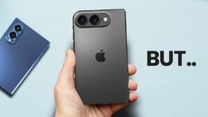 Close-up of iPhone Ultra foldable hinge and rounded frame while the phone is partially open on a desk.