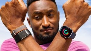The Fitbit Air fitness tracker displayed next to a Whoop strap