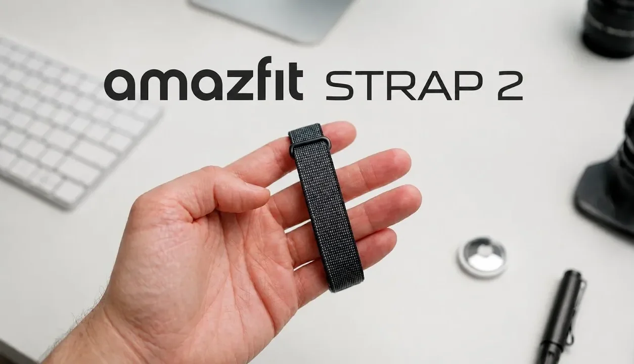 Amazfit Helio Strap 2 resting next to a smartphone showing AI coaching