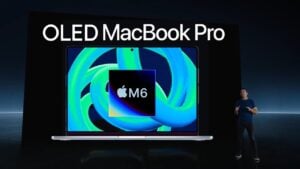 A person using the new touchscreen interface on an OLED MacBook Pro.