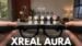Person wearing the XREAL Aura glasses for daily computing