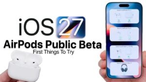 A pair of AirPods next to an iPhone downloading the beta update.