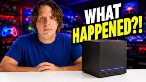 A sleek and compact Steam Machine resting on an entertainment center.