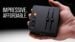 The Fosi C3 gaming DAC sitting on a desk next to a gaming headset.