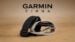 The Garmin CIRQA screenless fitness tracker resting on a table.