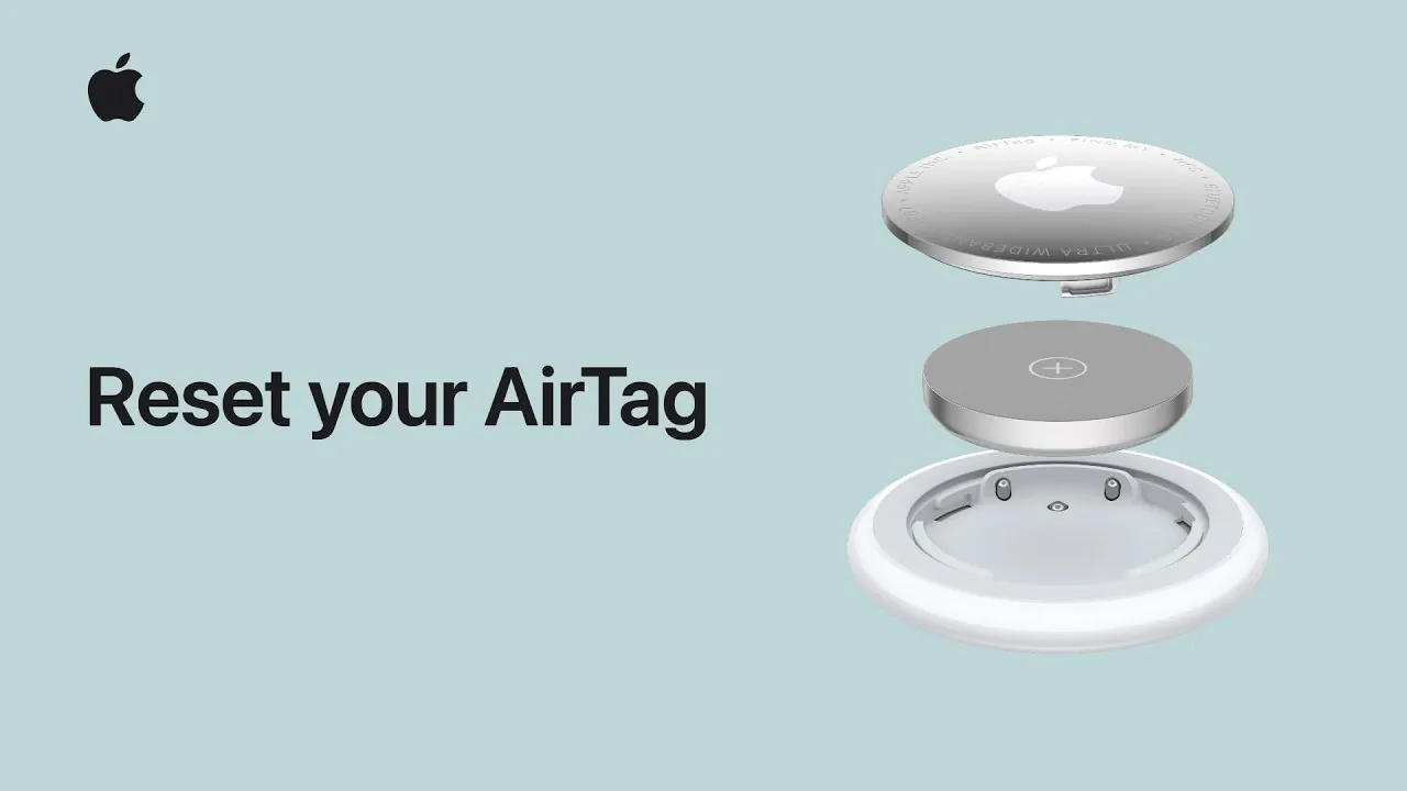 Pressing down on the AirTag battery to trigger the reset sound.