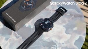 The titanium gray Galaxy Watch Ultra 2 displaying a customizable watch face.