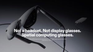 A pair of lightweight XREAL Aura augmented reality glasses viewed from the front.