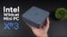 The BLink EQI mini PC resting on a wooden desk next to a monitor.