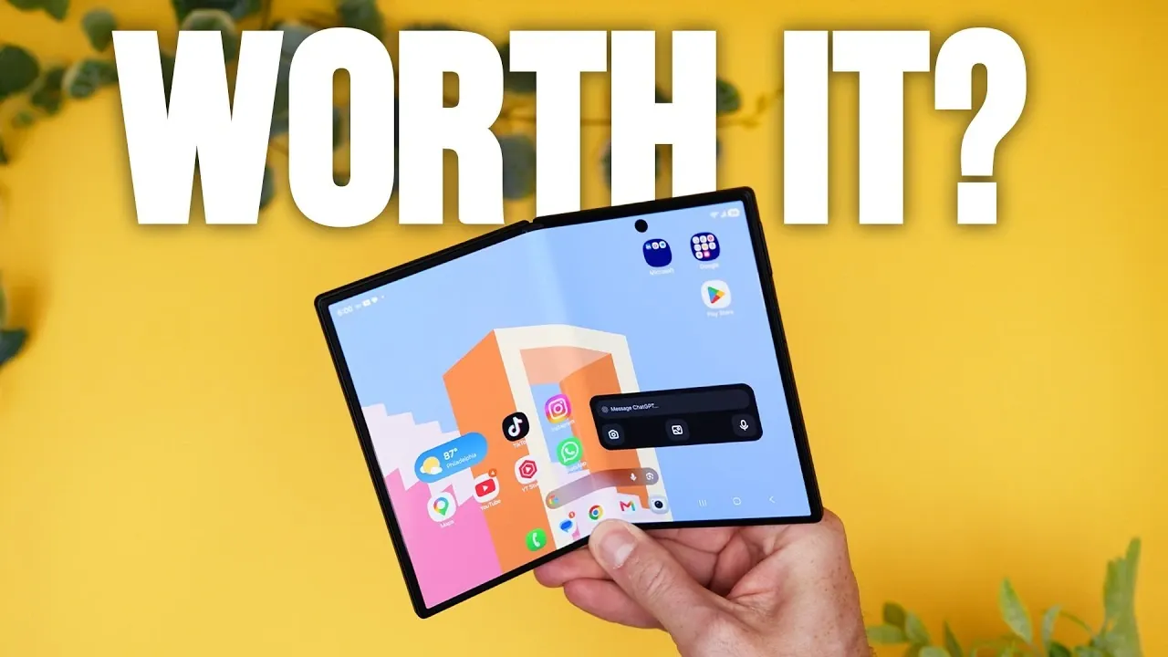 A user holding the passport-sized Galaxy Z Fold 8 in one hand.