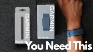 A black Garmin Cirqa armband fastened securely on a user's bicep.