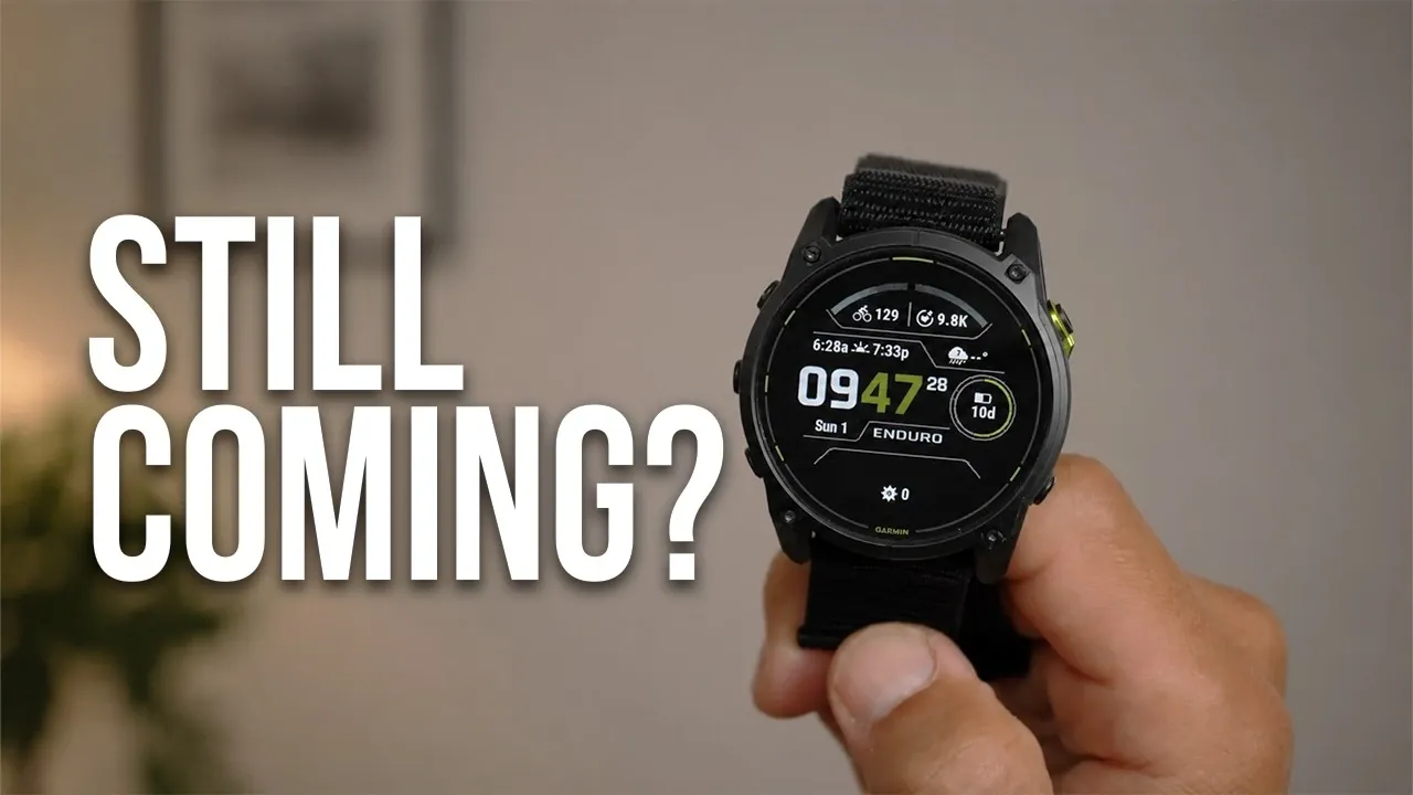 A rugged Garmin smartwatch resting on a rock outdoors.