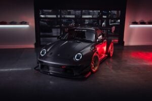 Front three-quarter view of the Gunther Werks GXR-Evo on a race track