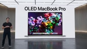 Concept render of a thinner OLED MacBook Pro with the screen turned on.