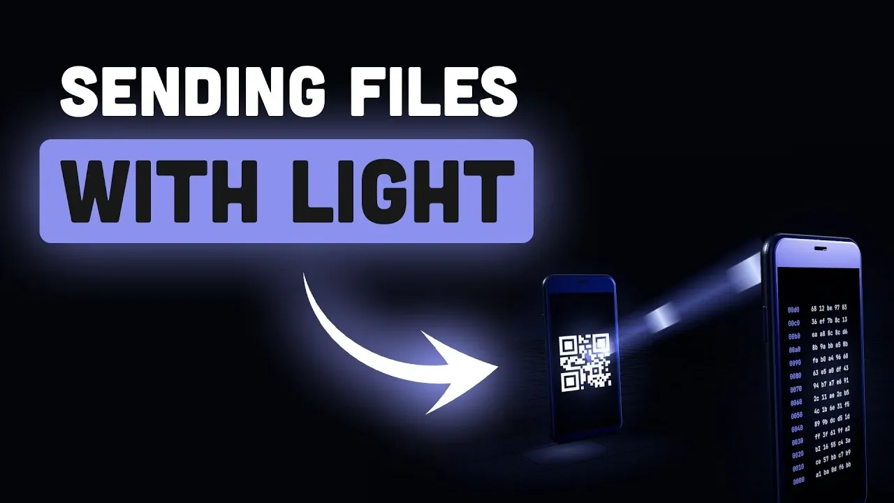 Two offline laptops positioned face-to-face for optical file sharing.