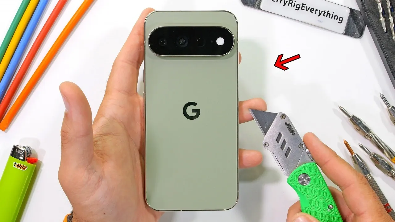 The 5,000 mAh battery inside the Pixel 11 Pro XL featuring removal pull tabs.