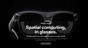 A person wearing the XREAL Aura smart glasses prototype.